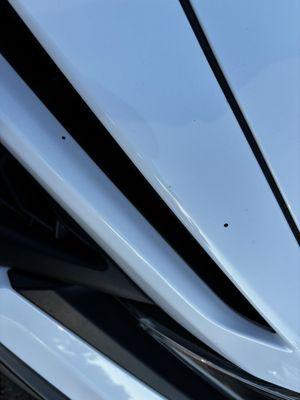 Tar on the front bumper