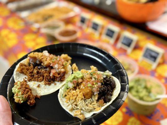 Chorizo and Chicken verde tacos with refried beans, rice, pico de gallo, guacamole, and four homemade salsas! Hits the spot!