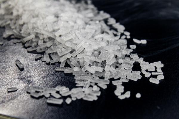 3mm dry ice pellets on a black surface