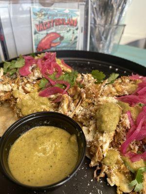 Carnitas and egg breakfast taco with roasted green chili salsa