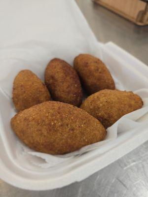 Kebbeh-crispy, deep-fried bulgur shells filled with seasoned ground meat and onions. A savory Middle Eastern favorite with a rich, hearty bi