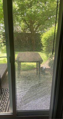 Shattered screen door from lawn people