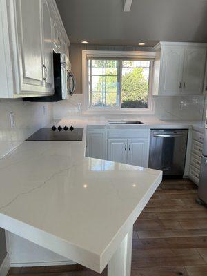 Quartz countertop and backsplash installed by Alan's team