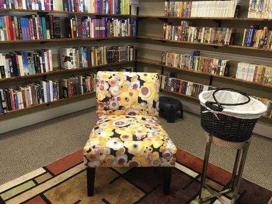 There are some chairs scattered around for reading throughout the store.
