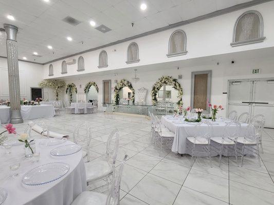 Reception hall with white throne in the middle of the hall