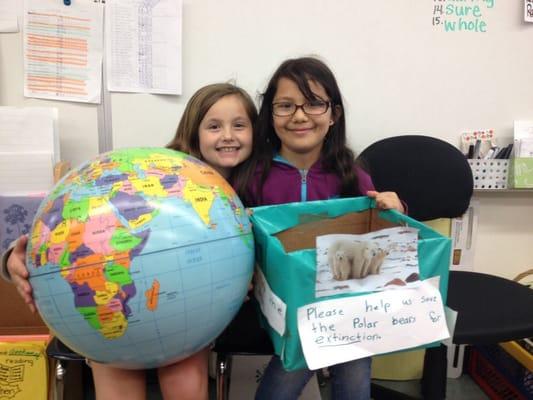 The second graders that started it all! Recycle a bottle and a can to save the endangered animal's land