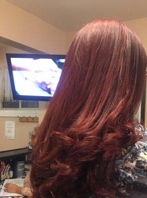 Straightened hair with waves.