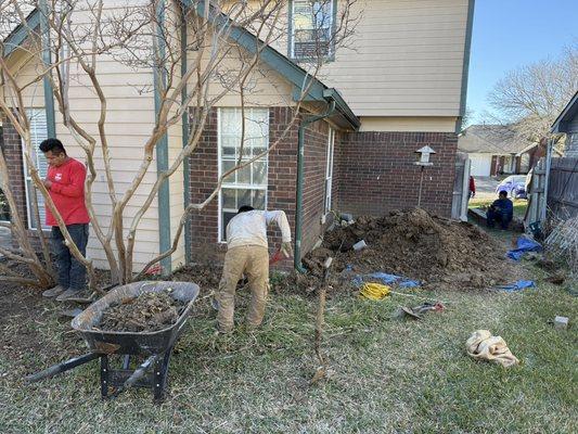 Soil cleanup and compaction around pier holes to ensure a clean, professional finish