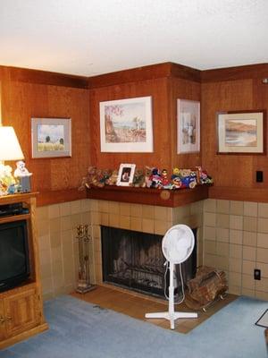 the old fireplace , dark and dated