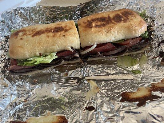 Grinder: Pat & Gary's Special Roast Beef, Pastrami, Cheese, Mild Pepper Rings, Onions, Topped with Spicy (Mild) Mayo.