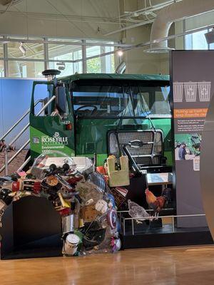 Garbage truck cab to climb into