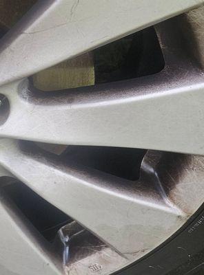 The same front wheel, blackened by brake dust, one week after having last cleaned/scrubbed it.