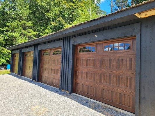 Amarr Hillcrest doors in Mahogany installed on this detached garage in Murphy, NC.
