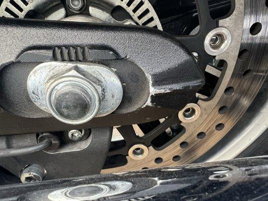 Scratched up swing arm and didn't set wheel straight and belt rubbed on rear pulley.