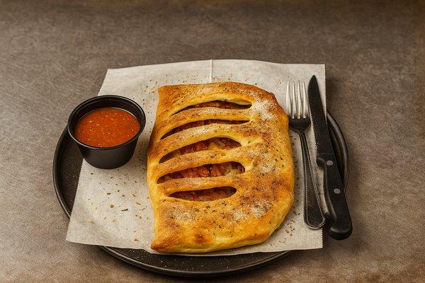 Meat lovers calzone, pepperoni, sausage, bacon and ham