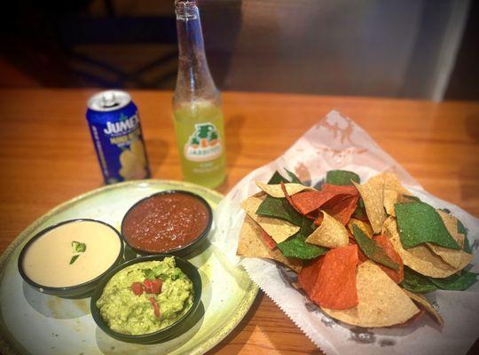 Chips and the trio dips (queso, guacamole and salsa)