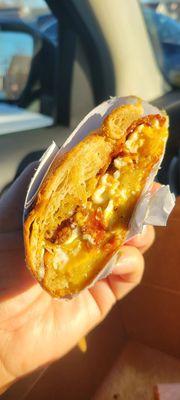 Eggs & bacon on a croissant.