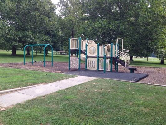 Second playground and swings with outdoor shelter