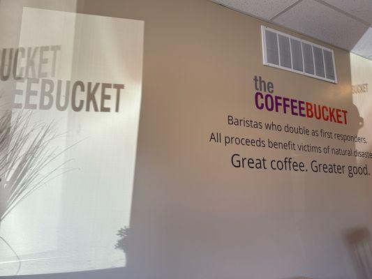 A shadow of the window sign on the wall that describes this place. So cool