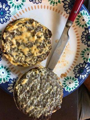 No lettuce tomato onion pickle nothing but cheese bun and burger