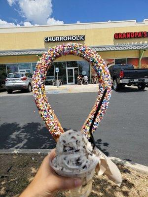 Cookies and creme ice cream and churro with sprinkles