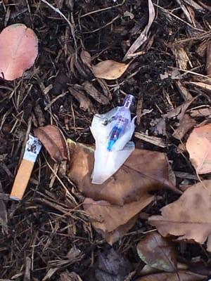 Disposed iv needle on the ground. Yuck