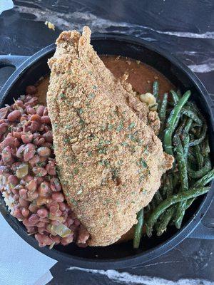 Cornbread skillet. Base... Mac n cheese, garlic green beans (Dayummm so good!!!!), red beans and rice and to top it off fried catfish!!!