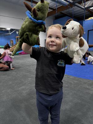 Socializing time! They put toys in the big blue circle and all of the kids play with each other while parents take a step back and watch.