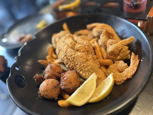 Seafood platter. Fish cornmeal's and cooked perfectly with crispy outside.