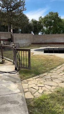 The back yard cleaned and edged around the pool.