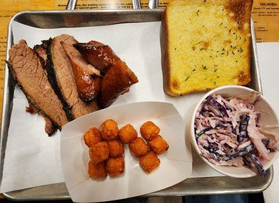 Brisket and sausage with sweet potato tots and coleslaw