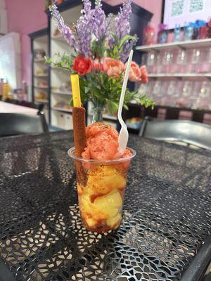 Mandonada. Mango ice cream with strawberry I cream. Tajín and chammoy.