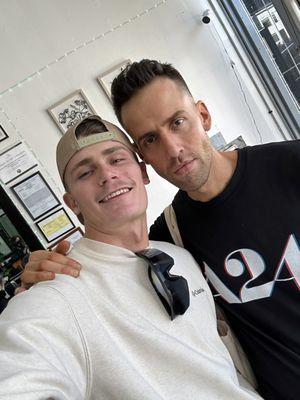 Me on the right post-haircut and my friend on the left pre-haircut. (I came in wearing a hat too)