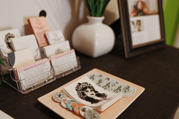 Pick up a business card or sticker from us!