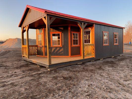 Utility Deluxe Playhouse in Dark Ebony Siding and Rustic Red Metal Roofing