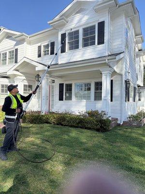Professional soft wash in action! Gently removing dirt and grime to reveal a bright, clean exterior--safe for siding, powerful on results!