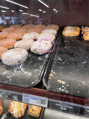 Donuts with a nasty fly