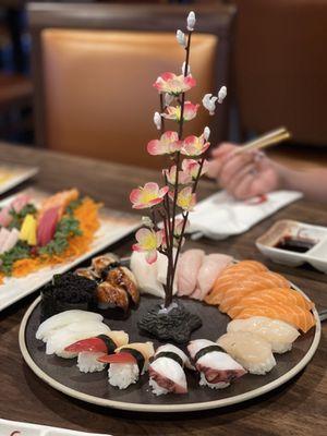Nirigi AYCE plate clockwise from eel Eel, white tuna, yellow tail, salmon, scallop, octopus, surf clam, squid, black masago
