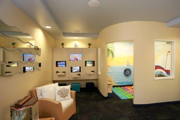Video game wall for the teens and tweens, and a tropical playroom for the toddlers