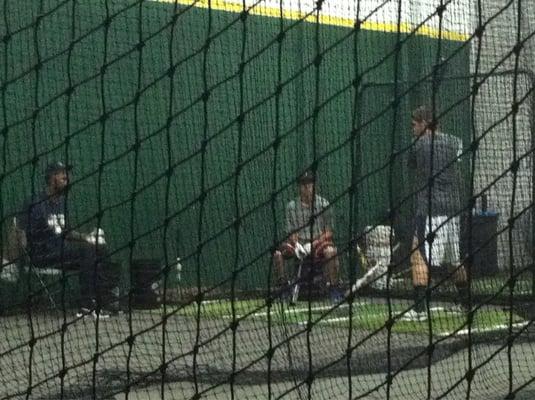 DJ in the cage working w/ players