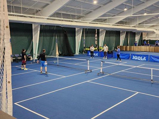 Coach Jacob Beck giving a Beginner Pickleball lesson.