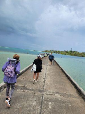 Walking to end of pier to meet water taxi