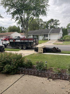 Old sofas getting ready to be loaded and hauled away.