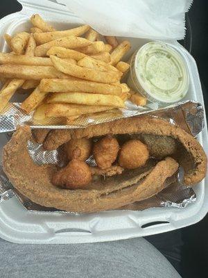 Trout, slaw, hush puppies and fries.. All homemade..