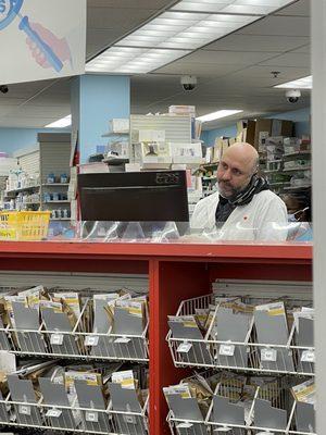 Head pharmacist not wearing a mask in the middle of Covid, despite a city mask mandate.