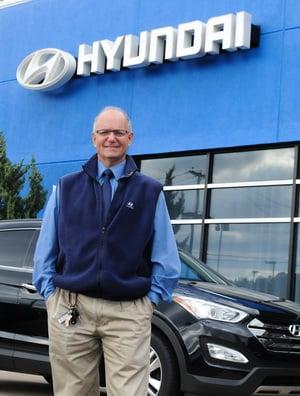 Salesperson, Mike Defeo in front of SMC Hyundai at our North 4th Street auto plaza.
