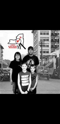 Team Demayzing taking a picture in front of our green screen after trying our 1920s barbershop room!