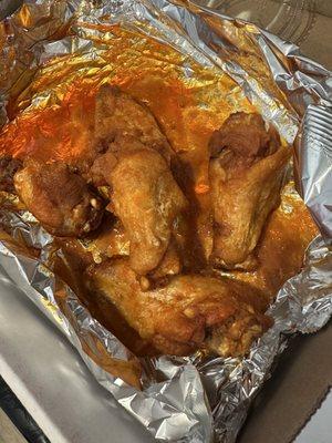 Medium wings. Half eaten.