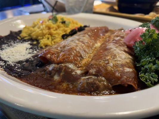 Tex Mex Beef enchiladas with yellow rice & black beans.