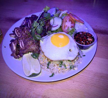 Beef short ribs with fried rice, egg on top